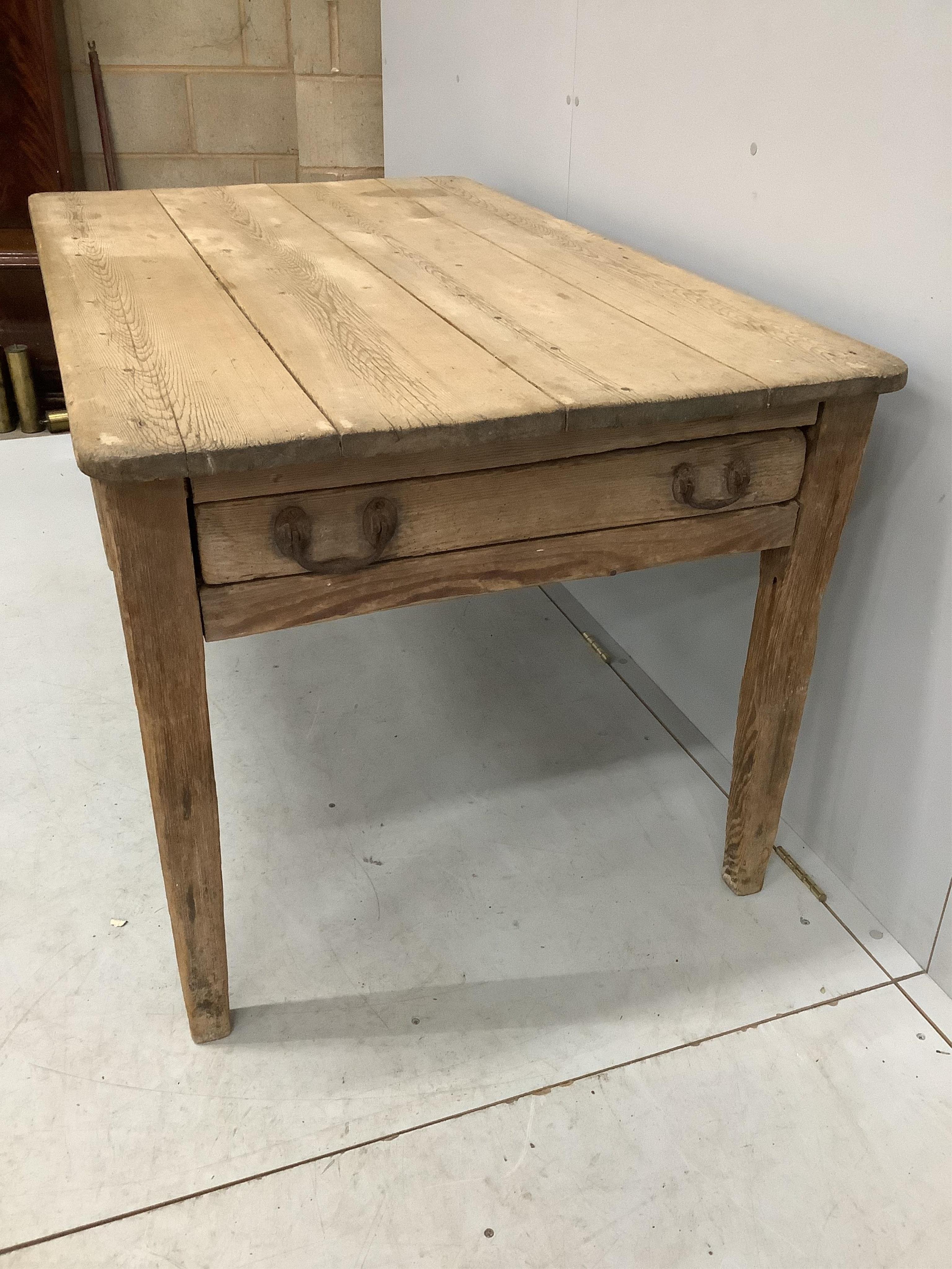 A 19th century rectangular scrubbed pine kitchen table fitted drawer on square tapered legs, width 144cm, depth 85cm, height 73cm. Condition - fair